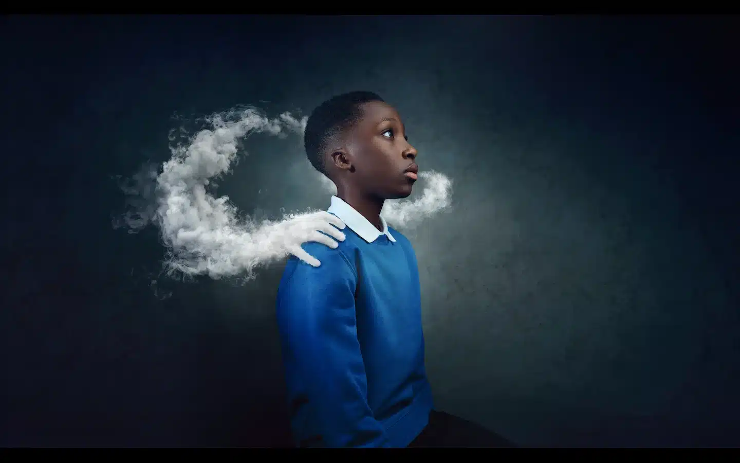 a photo of a child with a cloud of vapour around him
